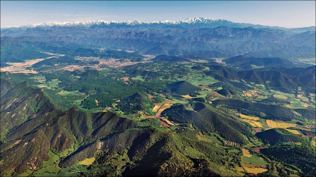 View over the northern part of Garrotxa VF, with the town of Olot in the middleground. (© turismegarrotxa.com)