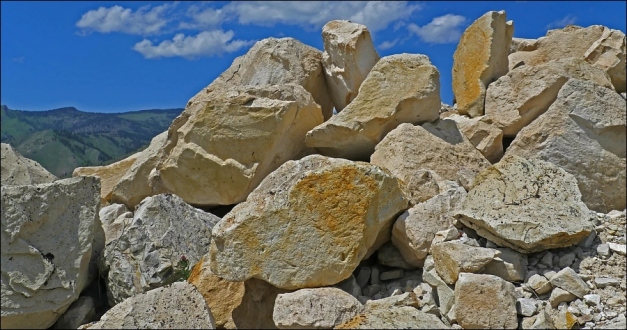 Tuff is often quarried and widely used for building stone and oad construction material. (© ignimbrite.com)